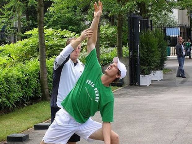 Tennis player Andy Murray practices yoga